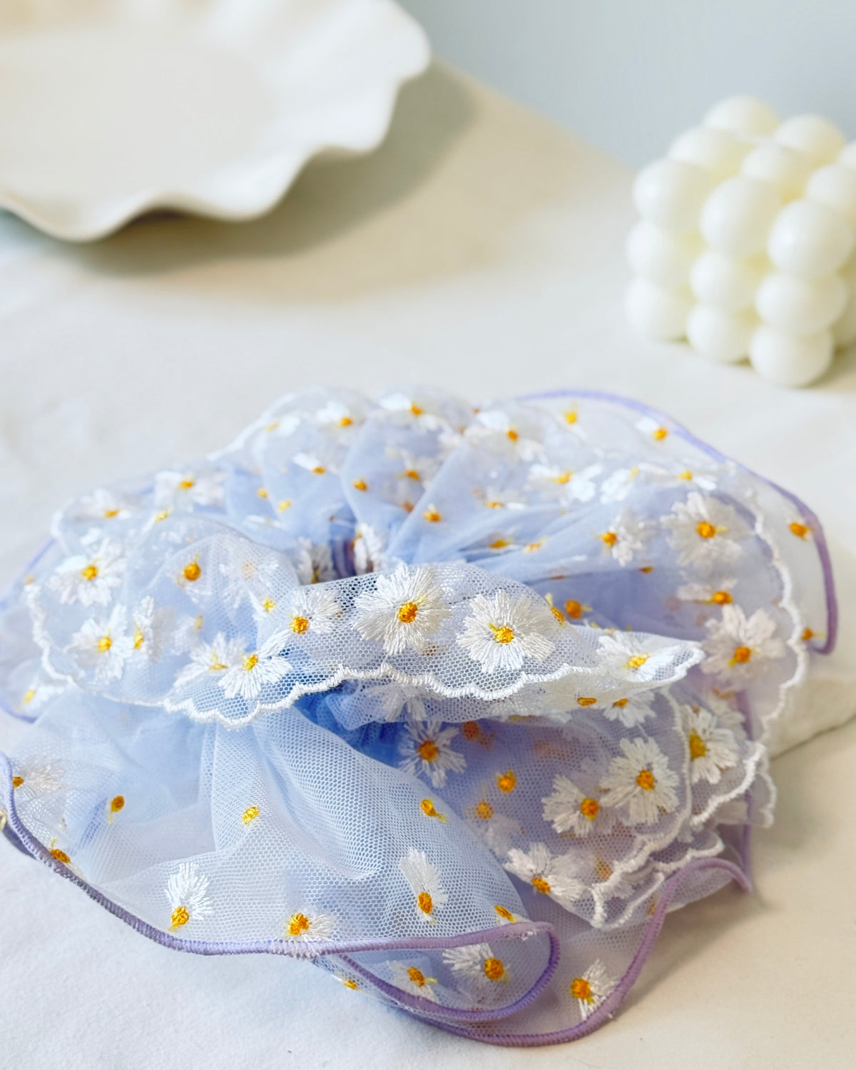 Floral cloud scrunchie flat lay — Cosa Cosa Hair