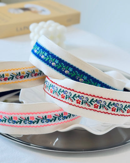 Floral embroidered headband close-up detail